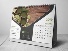 a desk calendar with green teas on it