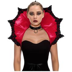 a woman wearing a black and red dress with an umbrella shaped like a headpiece