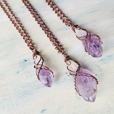 "Raw Amethyst Quartz necklaces. Oxidised Copper Wire wrapped beautiful good quality Amethyst Crystal necklace. Layers great with other necklaces. Love stone necklace. February birthstone. Choose your necklace length with a choice of 16\", 18\", 20\", 22\", 24\", 30\", 32\". These are Raw Natural Gemstones and vary in shape, color and size, each one is unique in its own way. Amethyst is a meditative and calming stone which works in the emotional, spiritual, and physical planes to provide calm, balance, patience, and peace. Amethyst is used as beneficial when dealing with legal problems and money issues, which can lead to prosperity and abundance, though it is not the best known prosperity stone. Emotionally, amethyst is used in crystal healing to help heal personal losses and grief, bringin Handmade Purple Crystal Necklaces, Crystal Pendant Necklace Diy Wire Wrap, Luxury Wire Wrapped Spiritual Jewelry, Rough Stone Wire Wrap, Luxury Wire Wrapped Healing Jewelry, Amethyst Wire Wrapped Necklace Gift, Electroformed Amethyst Crystal Necklace As Gift, Handmade Purple Necklace With Copper Wire, Handmade Purple Copper Wire Necklace