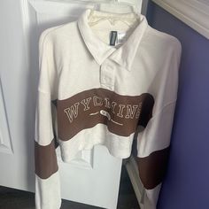 Cream And Brown Long Sleeve Graphic Tee. Cropped And Never Worn From H&M. Says “Wyoming” And Then “Usa” Below It. Size L Sporty Cream Tops With Letter Print, Cream Long Sleeve Top With Letter Print, Sporty H&m Tops For Fall, H&m White Graphic Print Tops, H&m White Long Sleeve Top, White Long Sleeve Top From H&m, H&m Long Sleeve Tops With Letter Print, H&m Cream Long Sleeve Top, H&m Long Sleeve Cream Top