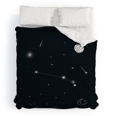 a black and white bed with stars and planets on it