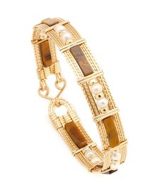 Beautiful wrapped wire bangle of 14k gold-filled wire with Tiger Eye Gemstone beads. Select from 4 different styles Approximately 1/2 inch wide. Tiger1 - Long Square Tube with Gold beads (BR_TigLSTGB_01) $119 Tiger2 - Long Square Tube w/Single Pearl & Gold beads (BR_TigLST1PGB_02) $129 Tiger3 - Long Square Tube with Pearls & Gold beads (BR_TigLSTPGB_03) $129 Tiger4 - Barrel with Pearls & Gold Beads (BR_TigBPGB_04) $129 Compass Jewelry, Single Pearl, Wire Bangles, Wire Wrapped Bracelet, Tigers Eye Gemstone, Jewelry Outfit, Gold Wire, Jewelry Inspo, Dream Jewelry