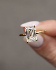 **Unique Emerald Cut Moissanite Engagement Ring, Simple Solitaire Wedding Ring, Hidden Halo Diamond Ring, 10k/14k Solid Gold Anniversary Ring** If you want to buy any item from us in wholesale, Please contact to us. We will give you more discount for that items. ❤ Description of Ring ↦ Center Stone Shape : Emerald Cut Moissanite ↦ Stone Size : 2.50CT ↦ Stone Measurement : 7x9mm ↦ Side Stone Shape : Round Cut Moissanite ↦ Stone Size : 0.15CTW (approx.) ↦ Stone Clarity : VVS1 ↦ Stone Color : D E F ↦ Stone Cut : Excellent ↦ Hardness : Moissanite 9.25 ↦ Lifetime warranty of moissanite sparkle ❤ Metal Options: ↦ We provide our all jewelry in below options -925 Sterling Silver -10KT Solid Gold -14KT Solid Gold -18KT Solid Gold -950 Platinum ❤ Please click on below link, Here is available collect Radiant Cut Solitaire Emerald Ring For Wedding, Radiant Cut Solitaire Emerald Wedding Ring, Timeless Rectangular Emerald Wedding Ring, Rectangular Solitaire Wedding Jewelry, Wedding Moissanite Radiant Cut Emerald Ring, Rectangular Solitaire Wedding Rings, Emerald Cut Wedding Rings, Engage Ring, Wedding Ring Emerald Cut