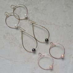 "White Freshwater Pearl Earrings~ These elegant sterling silver hoop earrings with a freshwater white pearl will look great for any occasion. Hammered and polished to a beautiful shine. Choose hoop size 1\" or 1.5\" Also available in 14k gold fill~ https://www.etsy.com/listing/199753367/white-pearl-hoop-earrings-small-gold?ref=shop_home_active_4 Also available with peacock pearls~ https://www.etsy.com/listing/269037112/peacock-pearl-earrings-freshwater-pearls?ref=listing-shop-header-0 Shop~bhttp Elegant Wire Wrapped Hoop Earrings For Anniversary, Silver Pearl Hoop Jewelry, Silver Hoop Jewelry With Pearl Drop, Silver Small Hoop Pearl Earrings For Anniversary, Silver Teardrop Pearl Hoop Earrings, Silver Small Hoop Pearl Earrings For Wedding, Sterling Silver Hoop Earrings With Pearl Drop For Anniversary, Silver Teardrop Hoop Earrings With Pearl Charm, Nickel-free Hoop Pearl Jewelry