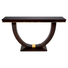 a wooden table with gold trimmings on the edge and a black top, against a white background