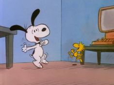 a cartoon character is dancing in front of a desk and computer screen with a dog on the floor