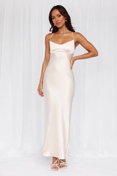 Length from top of bust to hem of size S: 132cm. 
 Chest: 36cm, Waist: 32cm, across front only of size S. 
 Maxi dress. 
 Lined. 
 Model is a standard XS and is wearing size XS. 
 True to size. 
 Non-stretch. 
 Luxurious satin. 
 Scoop neckline. 
 V-back. 
 Crisscross tie-up back. 
 Vent extension. 
 Straight, flowy silhouette. 
 Zipper with hook eye closure.  
 Cold hand wash only. 
 Polyester. 
 This material is very delicate. Please handle with care. 
 Please Note: This product is a Exclusive Satin Flowy Dress, White Satin Slip Dress, Slip Wedding Dress, Wedding Edit, White Satin Dress, Dress Pearl, Plisse Dress, White Slip Dress, White Bridesmaid Dresses