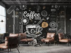 the coffee shop is decorated with chalkboard and leather chairs