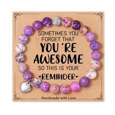 a bracelet with purple and white marble beads on it that says, sometimes you forget that you're awesome