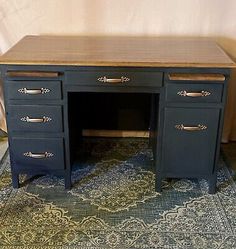 an antique desk with two drawers and a wooden top