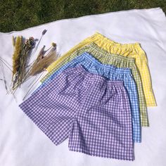 "These high waisted Gingham shorts are perfect for the spring! They have an elastic waistband with two lines of top stitch for a sporty yet elegant look. (1/4\" Gingham) Gingham shorts are approx 43cm long (can be made longer/shorter) - polycotton -Machine Washable Check out our website for more! https://eccentriclothing.bigcartel.com/products Instagram @eccentricclothing" Summer Plaid Shorts With Built-in Shorts, Spring High-waisted Pajama Shorts, Gingham Cotton High-waisted Shorts, High-waisted Gingham Cotton Shorts, Gingham Shorts With Elastic Waistband, Cotton Gingham Pajama Shorts With Elastic Waistband, Plaid Pajama Shorts With Elastic Waistband, Casual Gingham Shorts With Elastic Waistband, Gingham Cotton Shorts