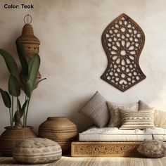 a living room filled with lots of furniture next to a potted plant on top of a wooden table