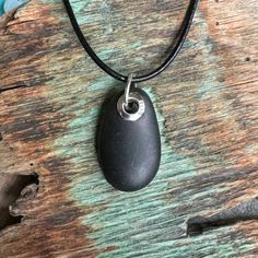 This necklace is made from a basalt beach stone I hand picked on the shoreline of the beaches from Kittery Maine to as far north as Beals Island Maine.  The grommet is sterling silver. Jump ring is welded. Kittery Maine, Beach Stones Jewelry, Black Basalt, Jewelry Black, Beach Stones, Stone Settings, Jump Rings, Hand Picked, Stone Jewelry