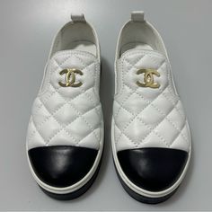 Chanel Lambskin Quilted Cc Stroll Sneakers White Women’s Eu 37.5/Us 7.5. Nwb And Dust Bag. This Is An Authentic Pair Of Chanel Lambskin Quilted Womens Cc Stroll Sneakers In White. These Stunning Sneakers Are Crafted Of White Lambskin Leather And Feature A Black Toe Cap With Black Stitched Chanel At Back And Black Rubber Soles White Flat Heel Slip-on Sneakers, Luxury Slip-on Sneakers With Textured Sole, White Slip-on Sneakers With Flat Heel, Luxury White Sneakers With Rubber Heel Cap, Luxury Sneakers With Rubber Heel Cap And Round Toe, White Slip-on Sneakers With Textured Sole, Classic White Slip-on Sneakers With Textured Sole, White Slip-on Sneakers With Textured Sole And Flat Heel, Luxury Calf Leather Slip-on Sneakers