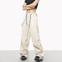 5ft 4''(163cm) tall, 97 lbs(44kg) weight and wearing a size M - Wide straight fit- Adjustable ankle- Adjustable waist- Drawstring- 6 colors Sporty Spring Pants, White Full-length Parachute Pants For Streetwear, White Stretch Straight Leg Cargo Pants, White Full Length Parachute Pants For Streetwear, Solid Color Full Length Sporty Pants, Sporty Beige Pants With Pockets, White Stretch Urban Bottoms, Spring Techwear Straight Leg Bottoms, Beige Full-length Parachute Pants For Streetwear