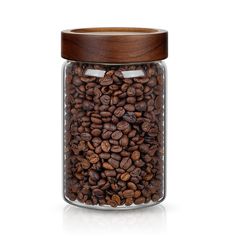 a glass jar filled with coffee beans