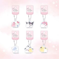 six keychais with different designs on them, all in pink and white colors