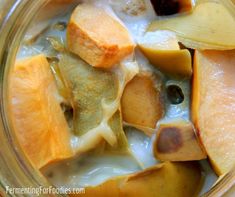 a glass bowl filled with fruit and yogurt