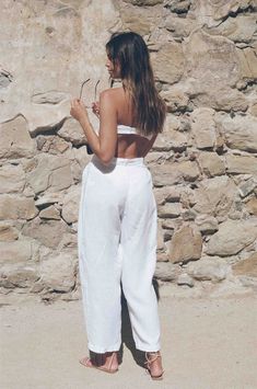 Vintage inspired white linen trousers, yes please! These natural dyed white linen trousers scream lets go on vacation and have ourselves a good time. They come with a linen tie that can be used as a matching tie top or hair tie. The tie is small, so we don't recommend expecting a full set out of it unless you are super tiny in the bust area. The white linen trouser has pleat detail in the front, belt loops and a dyed button for closure. The white linen trousers are pre shrunk for ultimate qualit White Linen Pants For Spring, White Linen Straight Pants, White Linen Wide Leg Vacation Pants, White Linen Wide Leg Pants For Vacation, White Linen Bottoms For Vacation, White Linen Pants For Beach, Chic Linen Beach Pants, White Linen Pants For The Beach, Summer Beach Linen Wide Leg Pants