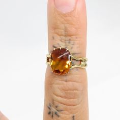 Vintage 14 gold Mandarin Citrine ring US Size 5 1/4 weight 2.26 grams front of the ring measures 11.1mm x 9.3mm the band is a unique flair style and secures the mandarin citrine with prongs. band measures 1.8mm at its thinnest point and 4.6mm at its widest part *SOLD AS IS* MANDARIN CITRINE HAS SLIGHT WEAR ON THE TOP OF THE STONE FROM AGE AND USE CAN BE TAKEN TO YOUR JEWELER TO BE BUFFED AND POLLISHED STILL AN INCREDIBLY STUNNING RING PLEASE BE ADVISED PHOTOS ARE CLOSE UPS TO SHOW DETAIL, PLEASE Faceted Topaz Yellow Gold Rings, Faceted Yellow Gold Topaz Rings, Yellow Gold Faceted Topaz Rings, Yellow 14k Gold Emerald Cut Rings, Gold Citrine Ring With Prong Setting, Gold Citrine Rings With Prong Setting, Yellow Gold Citrine Topaz Ring, Emerald Cut, Formal Amber 14k Gold Ring, Citrine Yellow Gold Ring With Prong Setting