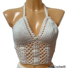 Beautiful lace halter top made with acrylic yarn. Model is a size 8/S. can fit a 10 depending on how you lace up the back. Message me for more sizes and different colours. White Crochet Trim Triangle Top, Vacation White Crochet Lace Halter Top, Fitted Crochet Lace Halter Crop Top, Fitted Crochet Trim Halter Neck Top, White Crochet Lace Halter Top For Vacation, White Fitted Crochet Triangle Top, Fitted Crochet Lace Cami Crop Top, Fitted Halter Neck Crochet Top With Crochet Trim, White Fitted Halter Top With Crochet Trim