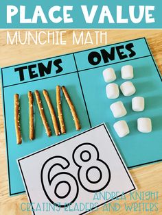 a place value mat with marshmallows on it and the words ten's ones