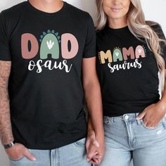 two people standing next to each other wearing matching shirts that read dad and son, mama and saunts