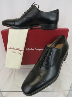 SALVATORE FERRAGAMO BOSTON BLACK BROGUE LEATHER GANCINI BIT LACE-UP OXFORDS By SALVATORE FERRAGAMO MADE IN ITALY 100% AUTHENTIC,GUARANTEED !!!!! Size: US 10 D Color: Black (Print on the box) Calf leather upper Leather Lace-Up Detail Leather lined "SALVATORE FERRAGAMO" stamped leather insole "Ferragamo" Lettering Stamped logo Rubber sole Silver tone metal Gancini bit detail at the back Heel Brogue Almond Cap Toe Original Price: $695 NOTE !!! These shoes came from Ferragamo's brand name store in i Designer Fitted Oxfords With Brogue Detailing, Designer Fitted Leather Office Shoes, Designer Fitted Oxfords With Pointed Toe, Designer Brogue Leather Shoes For Business Casual, Designer Fitted Oxfords For Business, Designer Fitted Leather Shoes For Semi-formal Occasions, Designer Semi-formal Leather Shoes, Designer Fitted Leather Business Shoes, Designer Fitted Leather Shoes For Work