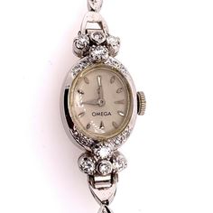 "Rare Ladies Collectable OMEGA 14k White Gold with approximately 1.25 carat of Natural Diamond Manual Wind Cocktail Watch.    It is set with 34 natural colorless diamonds weighing approximately 1.25 carats, the watch itself weighs 14.34 grams and is approximately 5.75\" inches in length.  Condition is Pre-owned. No original box, No original papers." Vintage Watch Claw, White Gold Diamond Watch With Single Cut Diamonds, Timeless Wedding Platinum Diamond Watch, Elegant Platinum Jewelry With Brilliant Cut, Timeless Platinum Diamond Watch For Wedding, Wedding Jewelry And Watches In Platinum With Brilliant Cut, Timeless Diamond White Platinum Watch, Brilliant Cut Platinum Diamond Watch For Formal Occasions, White Gold Diamond Watch For Formal Occasions