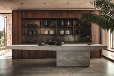 a large table with bowls on it in the middle of a room