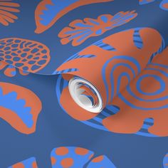 a blue and orange wallpaper with an abstract design in the center, on top of it