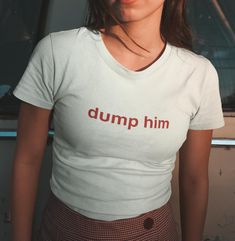 Dump him tee! This trendy Y2K tee is the perfect mix of vintage 90s charm and playful style. With a cute girl vibe, this cute and comfy graphic tee captures the coquette aesthetic while keeping things light and funny. ✨💖 SHIRT - Cute girls shirt featuring cap sleeves 🌸 - 100% cotton 🌼 - Double needle sleeve and bottom hems 💕 - Semi-fitted 🌟 - Tear-away label 🎀 CARE INSTRUCTIONS - Machine wash (max 30oC or 90oF) 🧼 - Tumble dry, iron, or steam on low heat 🔥 - DO NOT bleach 🚫 - DO NOT dry Dump Him Shirt, Trendy Shirts For Women, Dump Him, Y2k T Shirt, Girl Vibe, 90s Tees, Playful Style, 90s Shirts, Funny Girl