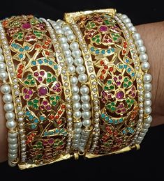 Traditional Beautiful  handcrafted Jadau designer bengles in semi precious pearls and stones  ◾22 carat gold plated  ◾ Repolishable Jewellery ◾Next to real jewellery ◾copper based jewellery Traditional Gold-plated Openable Jewelry, Traditional Meenakari Bangle For Formal Occasions, Elegant Meenakari Traditional Wear As A Gift, Festive Openable Gold Plated Jewelry, Gold Bollywood Jewelry With Openable Detail, White Stone Work Temple Jewelry Bangle, White Temple Jewelry Bangle With Stone Work, Heavy Temple Jewelry Bangle For Celebration, Traditional Formal Bangle With Stone Work