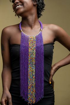 Unique Africa Maasai Handcrafted Beaded Necklace with an Elegant Look and Brilliant Finish. Color = Purple and Multi-Color Beads. Length (Around Neck) = 17 Inches / 43 Centimeters. Length ( Downwards ) = 14.5 Inches / 37 Centimeters. **GET FREE SHIPPING FOR ADDITIONAL ITEMS PURCHASED. Yes, Buy Multiple Items and pay shipping for 1 item only- The rest ships Free. (No Limits on the number of Multiple items). With a faster delivery time of 3 days via DHLExpress, Worldwide. Ordinary/Standard Shippin Traditional Purple Jewelry For Festival, Purple Traditional Festival Jewelry, Traditional Adjustable Purple Jewelry, Traditional Purple Beaded Necklace With Round Beads, Purple Choker With Colorful Beads For Gift, Traditional Handmade Purple Beaded Necklaces, Traditional Handmade Purple Necklaces, Traditional Purple Beaded Jewelry, Artisan Purple Adjustable Necklace