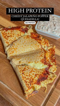 there are four pieces of cheese pizza on the cutting board next to a bowl of beans