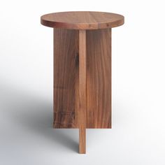 a small wooden table with one leg bent down and the other end turned to its side