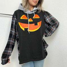 Reworked Halloween pumpkin hoodie with flannel sleeves. Measurements; 24" width (blue line), 25" length (red line) and 33" sleeves (green line). Please see last photo for measurements. Fits like a large sweater. Spooky Long Sleeve Winter Hoodie, Spooky Fall Streetwear Hoodie, Spooky Hooded Sweatshirt For Fall, Spooky Black Long Sleeve Hoodie, Black Long Sleeve Spooky Hoodie, Oversized Patchwork Hoodie For Fall, Spooky Hoodie Sweatshirt For Fall, Spooky Long Sleeve Cotton Hoodie, Spooky Cotton Long Sleeve Hoodie