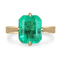 Displayed is a classic Colombian emerald solitaire emerald-cut engagement or right-hand ring in 14K yellow gold. This gorgeous solitaire ring carries a full 3.81-carat emerald in an offset four-prong setting. Fully faceted, this gemstone showcases excellent shine. The emerald has very good clarity with minor flaws that are normal in all genuine emeralds, but no carbon spots (black) or harsh flaws are found in this beauty! The gem has a stunning green color and very good luster. An ideal solitair Solitaire Gold Engagement Ring, Emerald Gold Ring, Emerald Necklace Pendant, Columbian Emeralds, Gold Solitaire Engagement Ring, Emerald Cut Engagement, Right Hand Rings, Hand Ring, Emerald Pendant