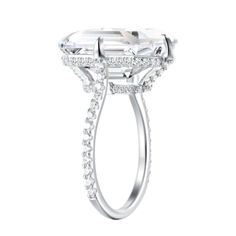 Wow your circle with this solitaire engagement ring from the Hidden Gems collection that combines the elegance of sterling silver with a sparkling emerald cut center stone made of AAA-grade cubic zirconia. Rhodium-plated 925 stamped sterling silver is polished to achieve maximum comfort and a mirror-like finish.    Fit for any occasion, adds the simple sophistication we all desire.    All stones are man-made, AAA-grade cubic zirconia. An excellent alternative to natural gemstones because it is m Formal Emerald Cut Halo Ring, Emerald Cut Sterling Silver Halo Ring For Formal Occasions, Formal Emerald Cut Lab Grown Diamond Ring, Formal Emerald Cut Halo Ring With Center Stone, Silver Emerald Cut Diamond Proposal Ring, Formal Radiant Cut Cubic Zirconia Halo Ring, Formal Radiant Cut Halo Ring In Cubic Zirconia, Emerald Cut Silver Diamond Proposal Ring, White Asscher Cut Halo Ring For Formal Occasions