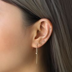 A statement and minimalist micro-pavé Diamond threader earrings set in ethically sourced natural diamonds and 14K solid gold. 14K Solid Gold Ethically sourced Diamonds Hypoallergenic. Lead and nickel free Carat 0.10, Color G, Clarity SI 1-2 Height 1.4in(3.6cm), Width 0.15in(3.5mm) #ED082-G Moms Bracelet, Choker Pendant, Gold Statement Ring, Studded Necklace, Nose Jewelry, Opal Color, Engraved Bracelet, Pink Gemstones, Threader Earrings