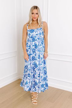 - This gorgeous dress is a floral fantasy! - Unlined material with a colorful abstract floral print - A scoop neckline - Adjustable spaghetti straps - A smocked back detail - A flowy yet flattering silhouette that ends in a midi length hemline Measurements S : Bust 32", Hip 40", Length 42.", Waist 30". M : Bust 34", Hip 42", Length 42.5", Waist 32". L : Bust 36", Hip 44", Length 43.5", Waist 34". Flowy Blue Sleeveless Dress With Floral Print, Light Blue A-line Midi Dress With Floral Print, Blue Floral Print Midi-length V-neck Dress, Beach Midi Dress With Ditsy Floral Print And V-neck, Vibrant Print V-neck Blue Midi Dress, Abstract Floral Print, Abstract Floral, Scoop Neckline, Midi Length