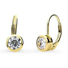 These solitaire dangle earrings are the definition of beauty, featuring lustrous round-cut stones in a modern and trendy bezel setting. Crafted with sterling silver, yellow gold flashed, stamped 925, nickel free. Set with premium quality 1.2 carat total (0.6 carat per stone, 5.5mm) round cubic zirconia in bezel setting. Earrings measure 0.59" in length, 0.26" in width. Leverbacks. Leverback Earrings, Cz Earrings, Inspired Jewelry, Accessories Jewelry Earrings, Gold Earrings Dangle, 2 Carat, Round Earrings, Grade 1, Bezel Setting