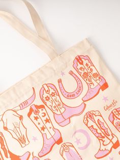 a tote bag with cowboy boots on it