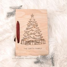 a wooden christmas ornament with a tree on it and the words, the smith family