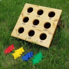 a wooden board game set on the grass