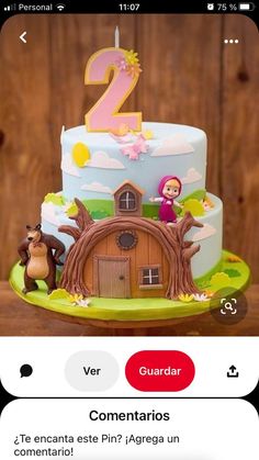 a birthday cake with the number two on it and an image of a farm house