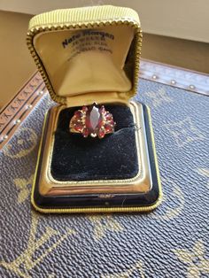 14k Yellow Gold & Garnet Cluster Ring Marked 14k Tested 14k 14.40 X 8.05 Center Stone Size 7 If you have any questions feel free to call me at 404 552 4535 Formal Multi-stone Garnet Rings, Estate Style 14k Gold Oval Jewelry, Formal Marquise Multi-stone Ruby Ring, Formal Multi-stone Marquise Ruby Ring, Collectible Garnet Ring Jewelry, Collectible Garnet Ring, Estate Oval Jewelry For Gifts, Formal Yellow Gold Garnet Cluster Ring, 14k Yellow Gold Garnet Jewelry