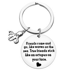 a keychain with a quote on it saying friends come and go like waves on the sea