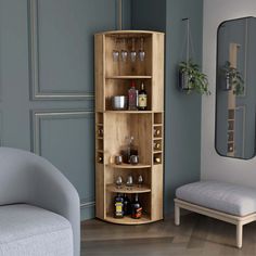 a corner cabinet with bottles and glasses on it next to a chair in a living room