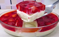 a bowl filled with ice cream and strawberries